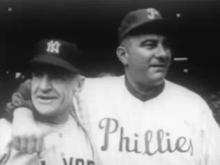 portrait shot of two men in baseball uniforms, one with an arm around the other