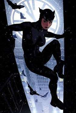 Catwoman scales a Gotham City building