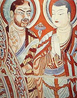 Painting with two monks, one with Central Asian traits, holding his index finger against his thumb; one with East Asian traits, holding his hands folded in front.