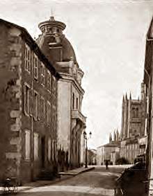 19th-century provincial French street scene with smart buildings