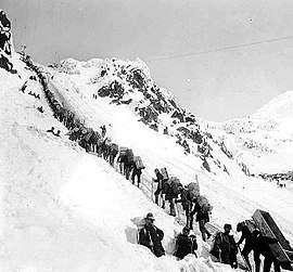Klondikers carrying supplies ascending the Chilkoot Pass, 1898.