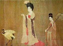 One plump woman wears a flower and chases a bird while another stands holding an umbrella.