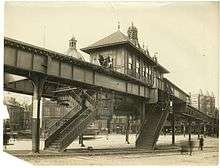 black white photo of an elevated train line