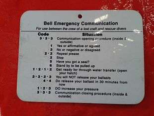 Emergency tap code signboard on a closed diving bell