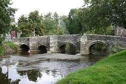 a water-level view of the Clun Bridge