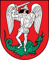 A coat of arms depicting an angel in full body armour and wings outspread while standing on a green dragon with a twisted tail