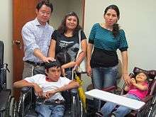 Congress member, Kenji Fujimori, donates wheelchairs to children with disabilities.