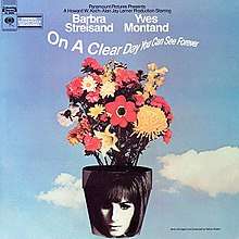 The vinyl sleeve of the album appears displaying Barbra Streisand's face superimposed on a pot of flowers atop a sky background.