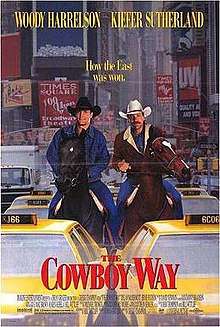 Two cowboys on horseback stuck in New York city traffic