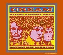 A psychedelic-style line drawing of the members of Cream (from left to right: Ginger Baker, Eric Clapton, and Jack Bruce), circa the late 1960s. The band members are pink with yellow and red highlights and the logo of the band and album name are red on a blue background. The autograph of artist John Van Hamersveld is in the lower right corner.
