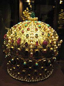 A golden crown decorated with gemstones
