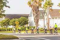 Cyclists cruising through The Villages.