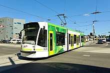 Green-and-white tram
