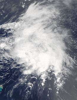 Satellite image of a disorganized mass of clouds over open waters