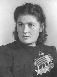 Postwar photo of Stanelienė wearing all three Orders of Glory and other medals