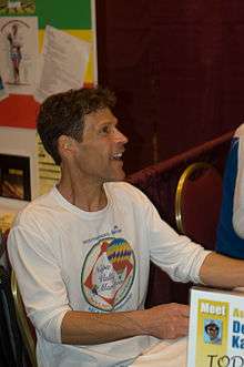 Dean Karnazes signing books before a marathon event in 2008