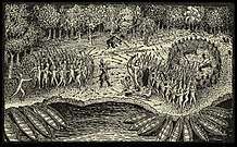 A black and white engraving.  Two masses of Native North Americans face each other in the center, firing at each other with bows and arrows.  In front of each group there are a number of canoes pulled up against the shore of a body of water.  In the background are trees.  Between the two groups stands a single man wearing some sort of armor.  He is firing a rifle or musket at the group on the right, and a puff of smoke rises from the weapon.  Further back near the trees are two other men who are also firing weapons at the group on the right.  Two wounded individuals are lying on the ground next to the group on the right.