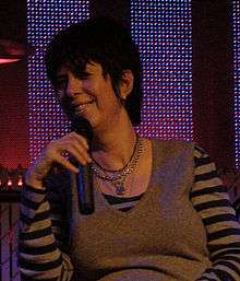 A woman holding a microphone