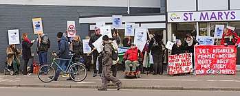 Disabled people protesting in 2015 against government policies and the inaccessibility of the assessment centre which has now been taken over by Maximus outside St Marys House, Norwich.