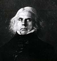 A black and white image, likely the reproduction of a painting, depicting a middle-aged man with long white hair