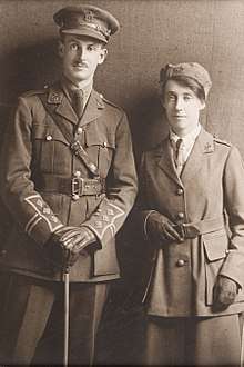 Three quarter length studio portrait of Lieutenant (Dr) Vera Scantlebury and her brother Captain George Clifford Scantlebury dressed in WWI military uniforms.