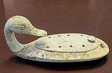 Duck container, a toilette article designed to hold make-up. Hippopotamus tusk, 13th century BC. Found at Minet el-Beida.