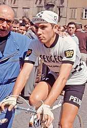 Eddy Merckx on a bike wearing the Peugeot team kit
