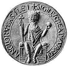 A coin-like device embossed with Edward the Confessor sitting on his throne in the centre and an inscription around the border.