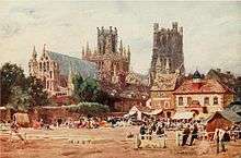 Watercolour The Market Place, Ely by W. W. Collins published 1908 showing northeast aspect of Ely Cathedral in the background with the Almonry in front of that and the now demolished corn exchange building to the right of the picture