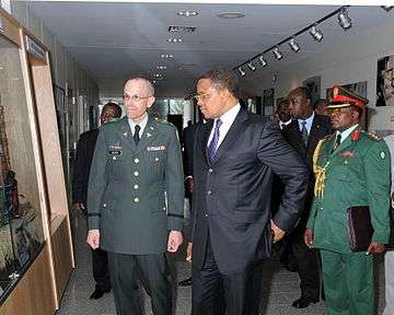 Dr. Jakaya Kikwete, President of Tanzania, with his aide-de-camp (right) in 2009