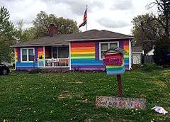 A house painted the colors of the LGBT pride flag