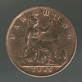 A copper coin with Britannia on it