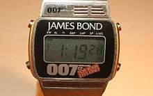 An oblong-shaped digital watch. Above the face is the name "JAMES BOND". Below the face are a stylised "007" and the logo of the film, "FOR YOUR EYES ONLY".