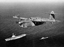 A Fairey Barracuda Mk II of 814 NAS, flying over HMS Venerable and an attendant destroyer, the Italian Alfredo Oriani.