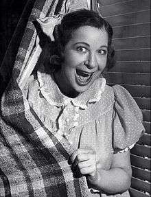 Fanny Brice dressed up as her character "Baby Snooks".