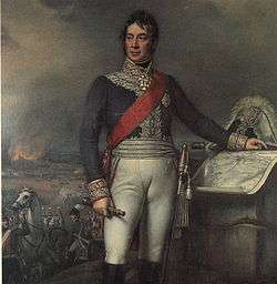 Painting shows a man standing with his left hand on a map while his left hand holds a telescope, while a battle rages in the background. He wears a blue military coat and white breeches while his bicorne hat sits on the map table.