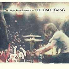 Album cover: a photo of people at a concert with the album and band name superimposed at the top