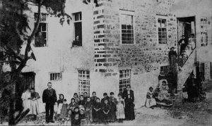 First Albanian School for girls, Korçë, 1899. Teachers Poliksena Luarasi and Thanas Sina, with students.