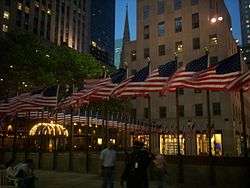 The flagpoles surrounding the Lower Plaza, with American flags on them