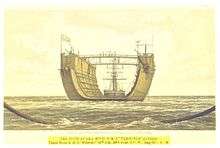 A large, U-shaped vessel, on the high seas, being towed by a sailing ship.