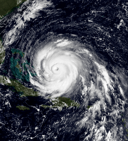 A view of Hurricane Floyd from Space on September 13, 1999. The storm is mature and well-defined, with a pronounced eye feature. Floyd is located over the Atlantic Ocean, and to the north and east of Cuba and Florida, respectively.