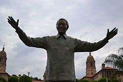 The statue of Nelson Mandela in front of the Union Buildings.