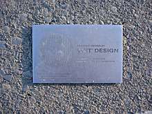 Stainless steel plaque showing fountain redesign was performed by WET Design using nozzles patented in 1988 and 1989 (US patents 4,978,066 and 4,852,801)