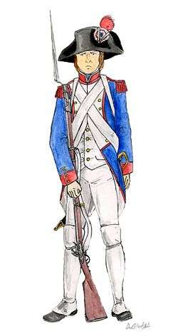 A French fusilier carries his long muzzled musket. He wears a blue jacket and white shirt and trousers; his cartridge belt is strapped across his chest and he wears a tri-cornered hat with a red revolutionary cockade.