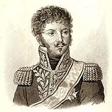 Black and white print of a curly-haired man with a moustache and Van Dyke beard. He wears a dark Napoleonic era general's uniform with epaulettes and a high collar with gold lace.