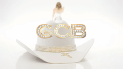A large white hat with gold trim.