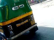 A dialogue and image of Gabbar Singh painted on the back of an auto rickshaw