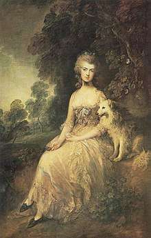 A woman seated in nature with her dog wearing a lacy 18th-century dress.