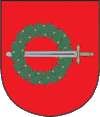 A coat of arms depicting a sword with a gold hilt and a silver blade penetrating a green wreath all on a red background