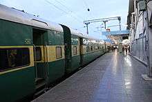 Green-and-yellow passenger train